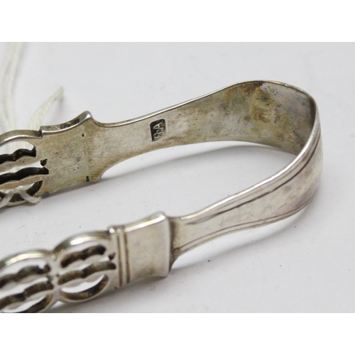 1098 - A pair of Georgian silver sugar tongs with pierced arms and shell ends, makers mark only for SA, pos... 