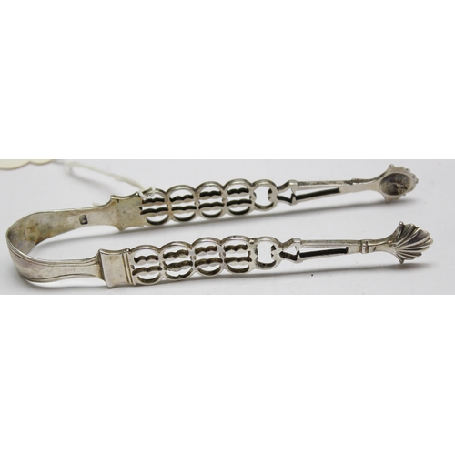 1098 - A pair of Georgian silver sugar tongs with pierced arms and shell ends, makers mark only for SA, pos... 