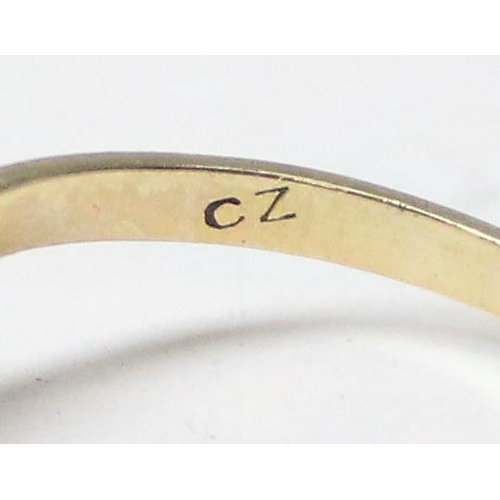 1172 - A 9ct gold wishbone ring set with white stones, approx size N, approx 1.03g gross