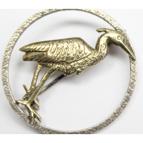 1174 - A retro silver and silver gilt brooch with Stork design, London 1983, approx 3cm diameter, 4.78g