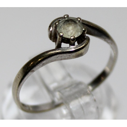 1171 - 9ct white gold and solitaire white stone ring in crossover setting, marked and XRF confirmed, approx... 