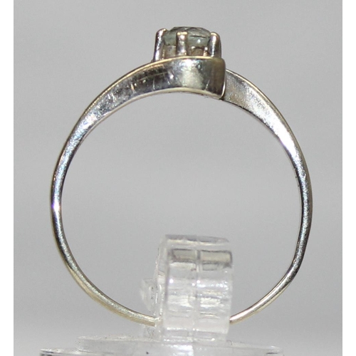 1171 - 9ct white gold and solitaire white stone ring in crossover setting, marked and XRF confirmed, approx... 