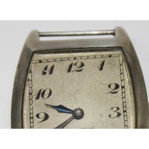 1308 - An Art Deco period silver cased cushion faced wristwatch, import marks for London 1926, movement unm... 