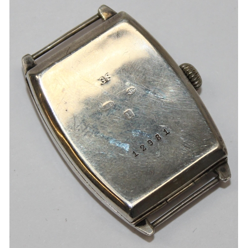 1308 - An Art Deco period silver cased cushion faced wristwatch, import marks for London 1926, movement unm... 