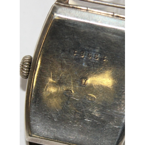 1308 - An Art Deco period silver cased cushion faced wristwatch, import marks for London 1926, movement unm... 