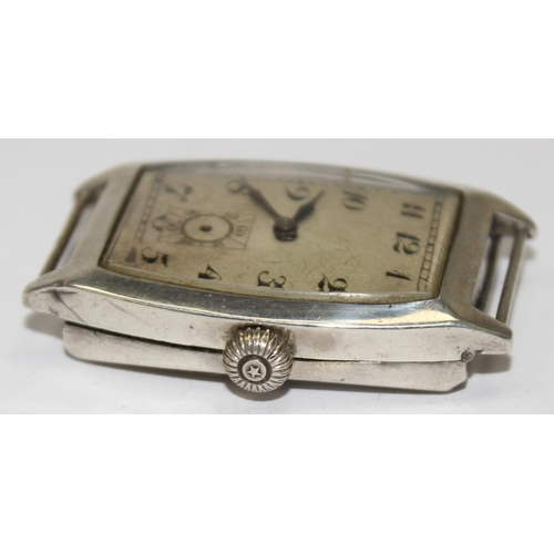 1308 - An Art Deco period silver cased cushion faced wristwatch, import marks for London 1926, movement unm... 