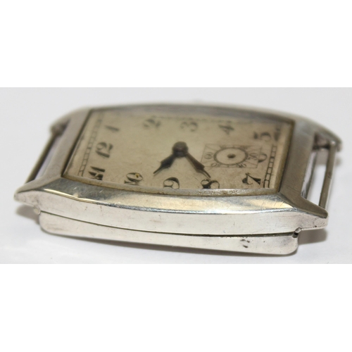 1308 - An Art Deco period silver cased cushion faced wristwatch, import marks for London 1926, movement unm... 