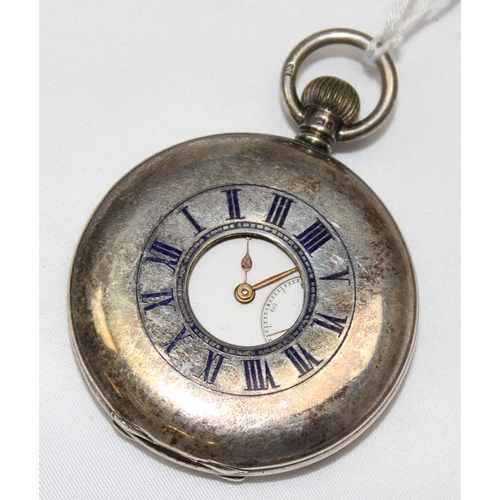 1332 - An antique silver cased half hunter pocket watch, enamel dial with Roman numerals, case with blue en... 