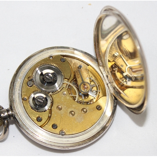 1332 - An antique silver cased half hunter pocket watch, enamel dial with Roman numerals, case with blue en... 