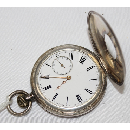 1332 - An antique silver cased half hunter pocket watch, enamel dial with Roman numerals, case with blue en... 