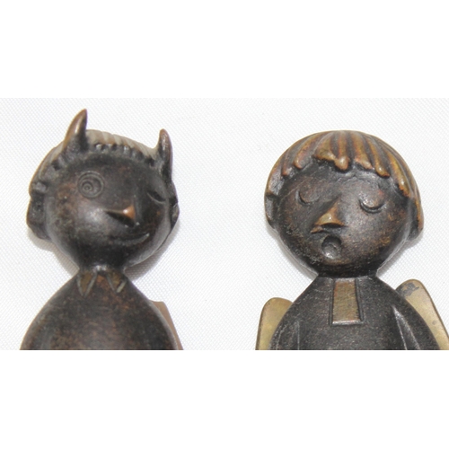 1601 - A pair of mid-century WHW Hagenauer cast bronze figures of an Angel & Devil, the angel marked to bas... 