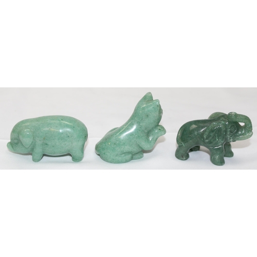 1604 - 3 small carved green hardstone animals, possibly Jade, Elephant, Pig and Cat, the largest approx 60m... 