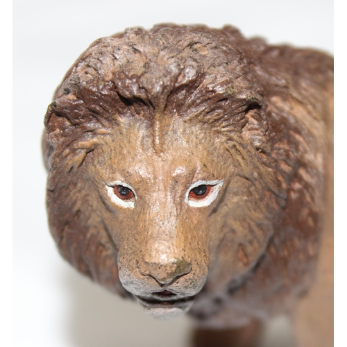 1695 - A Bergmann style cold painted metal model of a standing lion, amphora with B mark to base, approx 10... 