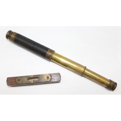 655 - A small vintage brass and leather 2 drawer telescope and a small wooden spirit level (2)