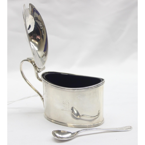 1063 - A large and impressive Victorian solid silver mustard pot with engraved armorial crest and blue glas... 