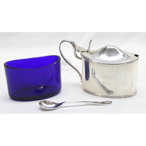 1063 - A large and impressive Victorian solid silver mustard pot with engraved armorial crest and blue glas... 