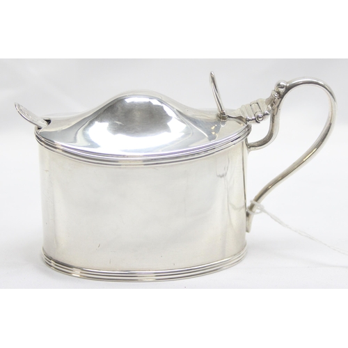 1063 - A large and impressive Victorian solid silver mustard pot with engraved armorial crest and blue glas... 