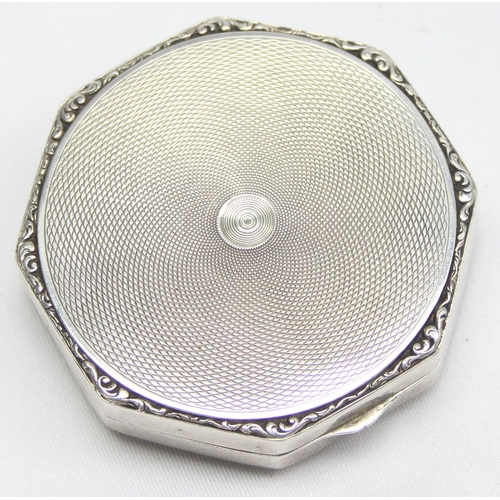 1068 - An Art Deco period silver, black enamel and marcasite compact with mirror, import marks for London 1... 