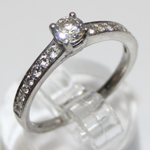 1104 - A Platinum and diamond ring, approx 0.52ct of diamonds in the solitaire and shoulders, marked and XR... 