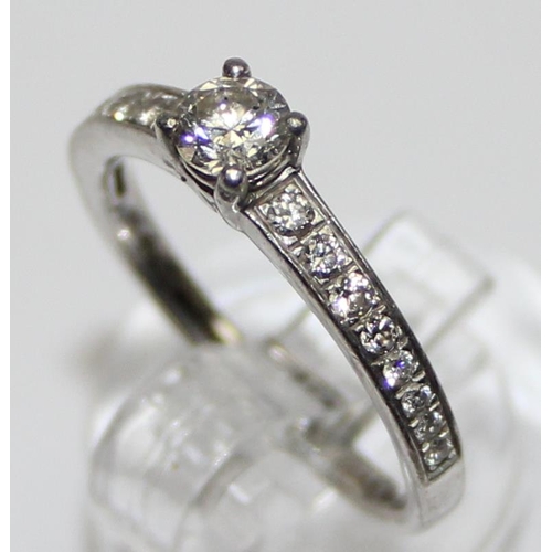 1104 - A Platinum and diamond ring, approx 0.52ct of diamonds in the solitaire and shoulders, marked and XR... 