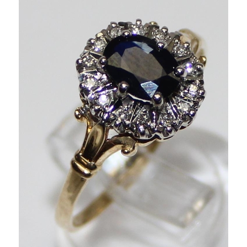 1105 - 9ct gold sapphire ring surrounded by small diamonds, marked and XRF confirmed, approx size U, approx... 