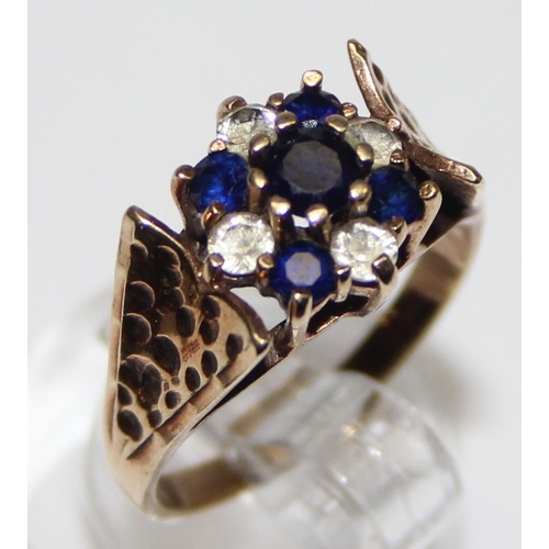 1122 - A retro 9ct gold sapphire and white stone cluster ring, marked and XRF confirmed, approx size M, app... 