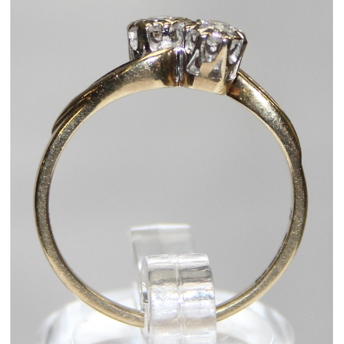 1130 - 9ct gold diamonds crossover ring, marked and XRF confirmed, approx size P, approx 2.55g gross