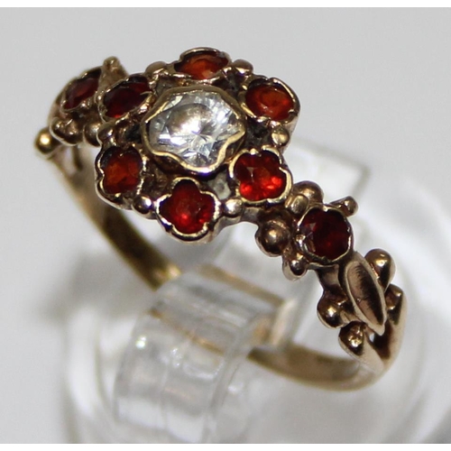 1131 - 9ct gold Georgian style floral set red and white stone ring, marked and XRF confirmed, approx size M... 