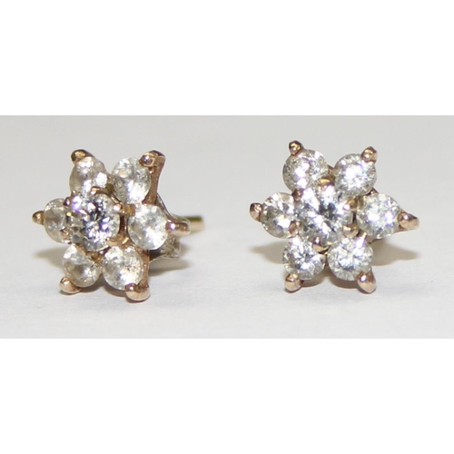 1140 - A pair of 9ct gold floral set white stone earrings, seemingly unmarked but XRF confirmed, approx 1.1... 