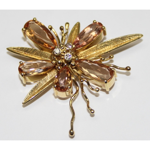 1143 - A vintage 18ct gold pendant formed as a flower, the piece formed with textured gold, citrines and th... 