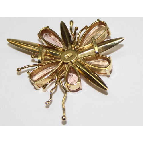 1143 - A vintage 18ct gold pendant formed as a flower, the piece formed with textured gold, citrines and th... 