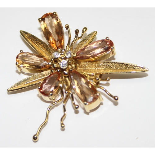 1143 - A vintage 18ct gold pendant formed as a flower, the piece formed with textured gold, citrines and th... 