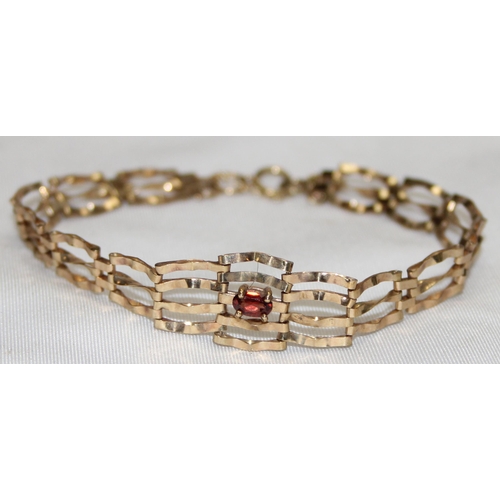 1159 - 9ct gold gate bracelet set with a cut gemstone, possibly a Topaz, marked 375 and XRF confirmed, appr... 