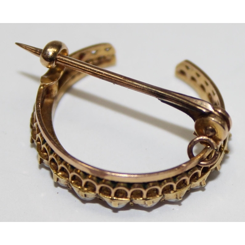 1166 - A 14ct gold and seed pearl set crescent shaped brooch, seemingly unmarked but XRF tests as 14ct gold... 