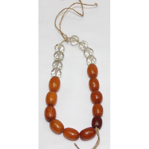 1169 - A vintage bead necklace, possibly Amber, the largest bead approx 24mm wide and a further bracelet wi... 