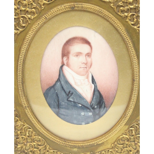 404 - A 19th century portrait miniature of a Regency gentleman in highly decorative brass frame, seemingly... 