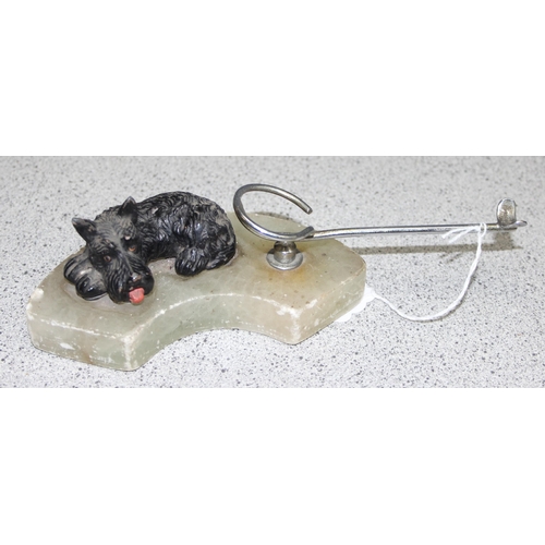 1699W - An Art Deco period cold painted spelter model of a black Scottie dog on marble base with pipe rack, ... 