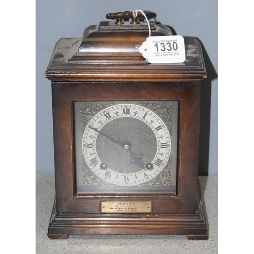 1330 - A vintage mahogany cased bracket clock with mechanical movement by Garrard, brass and silvered dial ... 