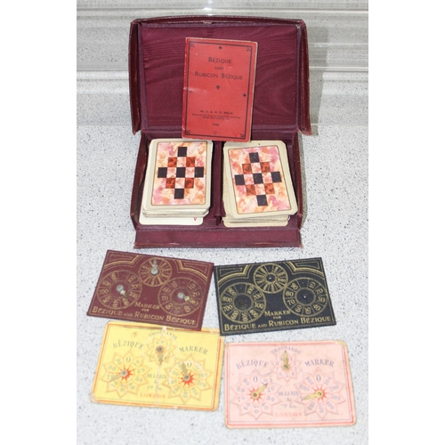 1546 - An antique Moroccan leather cased Bezique box and other playing cards etc