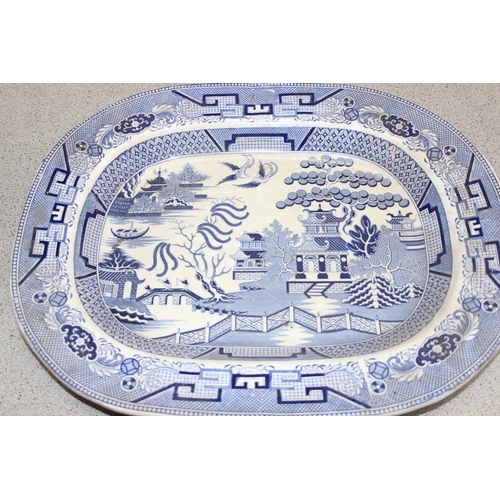 1699N - 2 large antique blue & white meat plates, Willow pattern approx 45cm x 37cm & another smaller exampl... 