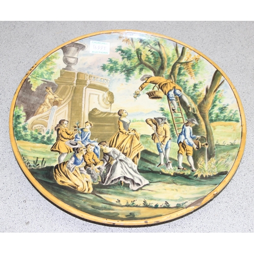 1699T - A large Italian Maiolica style charger decorated with a classical scene of fruit picking - likely 19... 