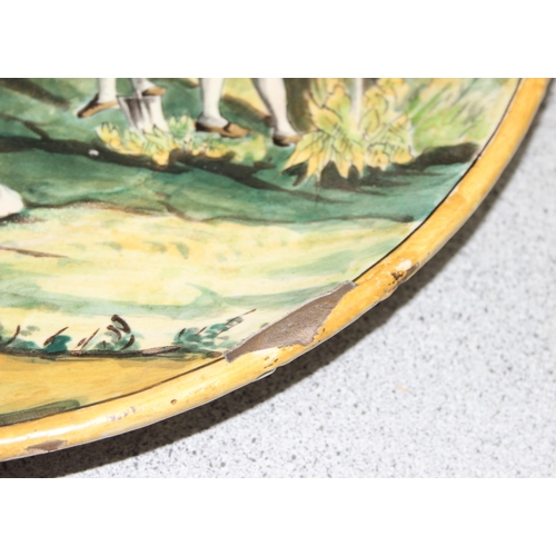 1699T - A large Italian Maiolica style charger decorated with a classical scene of fruit picking - likely 19... 