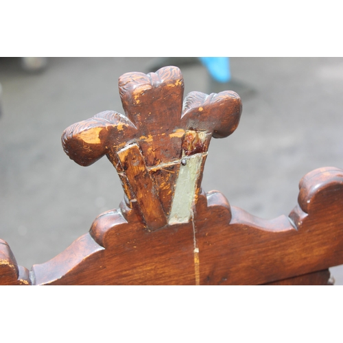 197 - A 17th century style carved oak hall chair with upholstered seat, likely late 19th or early 20th cen... 