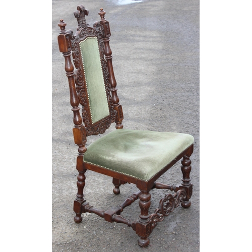 197 - A 17th century style carved oak hall chair with upholstered seat, likely late 19th or early 20th cen... 