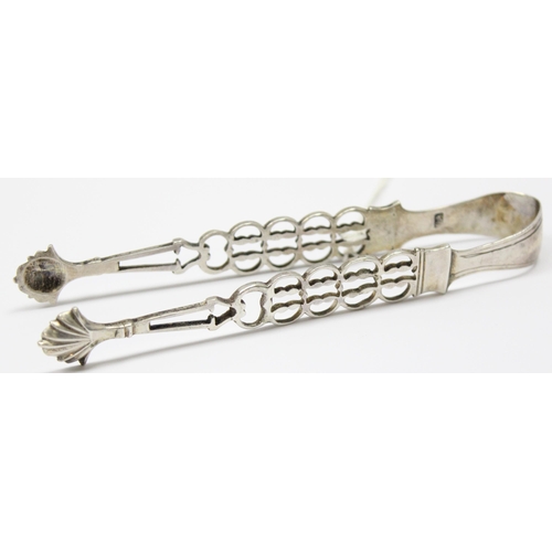 1098 - A pair of Georgian silver sugar tongs with pierced arms and shell ends, makers mark only for SA, pos... 