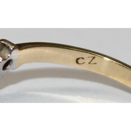 1172 - A 9ct gold wishbone ring set with white stones, approx size N, approx 1.03g gross