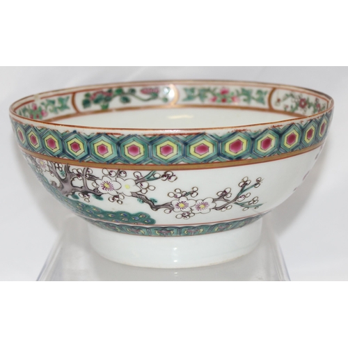 1686B - An antique Chinese bowl with polychrome enamel decoration depicting birds and prunus trees, unmarked... 