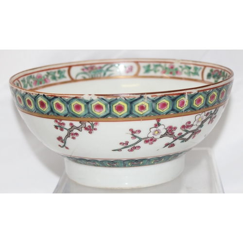 1686B - An antique Chinese bowl with polychrome enamel decoration depicting birds and prunus trees, unmarked... 