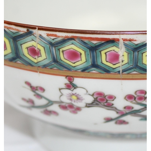 1686B - An antique Chinese bowl with polychrome enamel decoration depicting birds and prunus trees, unmarked... 