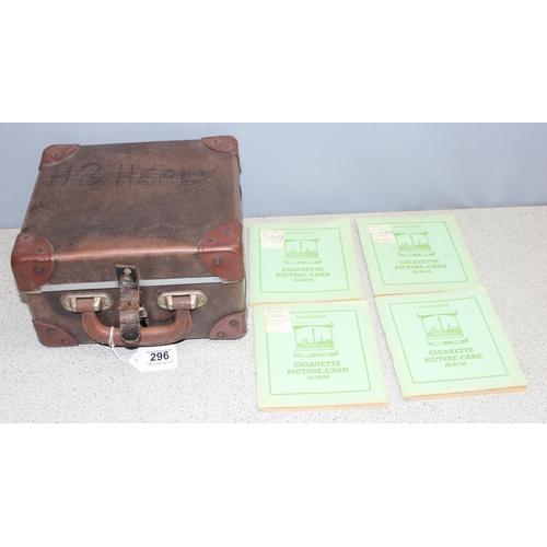 296 - A vintage brown bus conductors ticket box containing 4 cigarette card albums